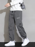 kkboxly  Men's Trendy Solid Cargo Pants With Multi Pockets, Casual Drawstrings Joggers For Outdoor